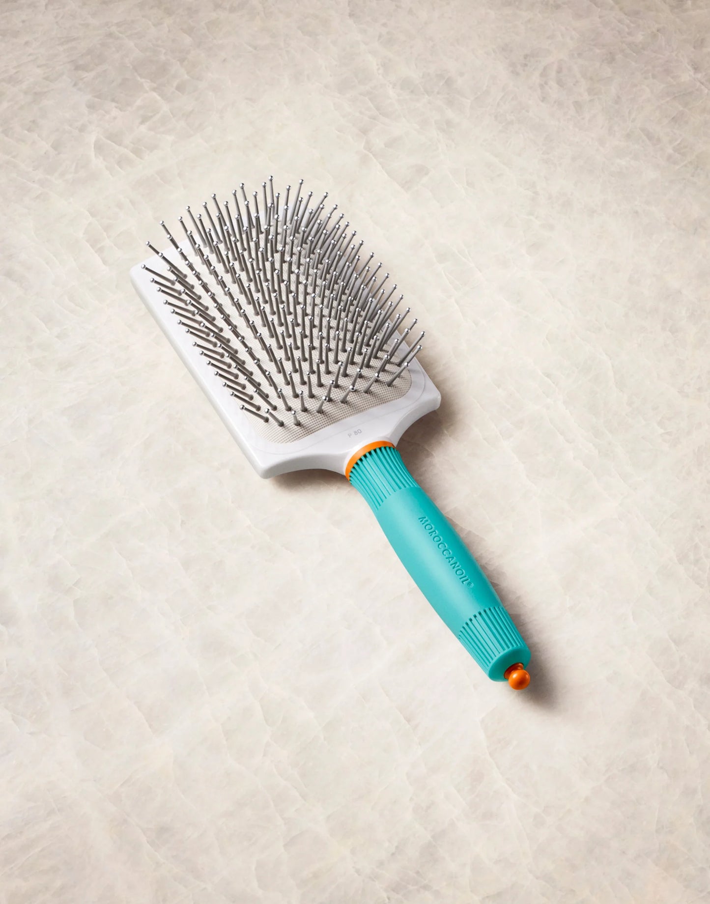 Ceramic paddle brush